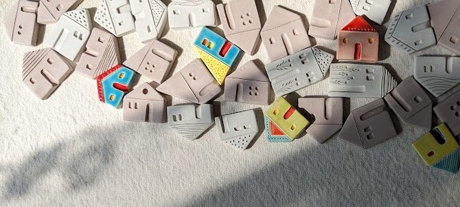 A collection of colourful handmade ceramic houses